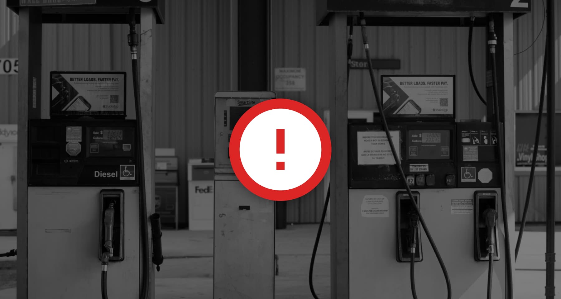 background image of diesel pumps at a truck stop with a red exclamation mark in foreground
