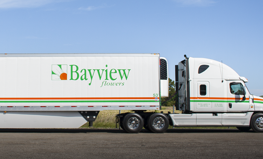 Bayview Flowers logo is sprawled across the trailer and cab of semi truck